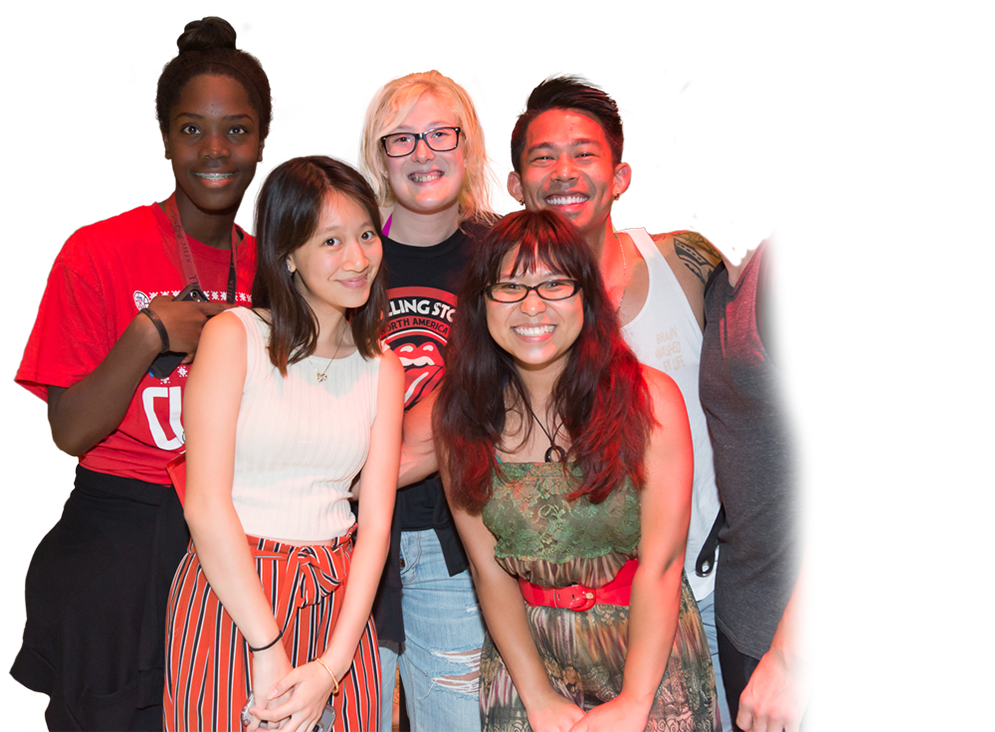 Group shot of six smiling students at Aztec Nights event